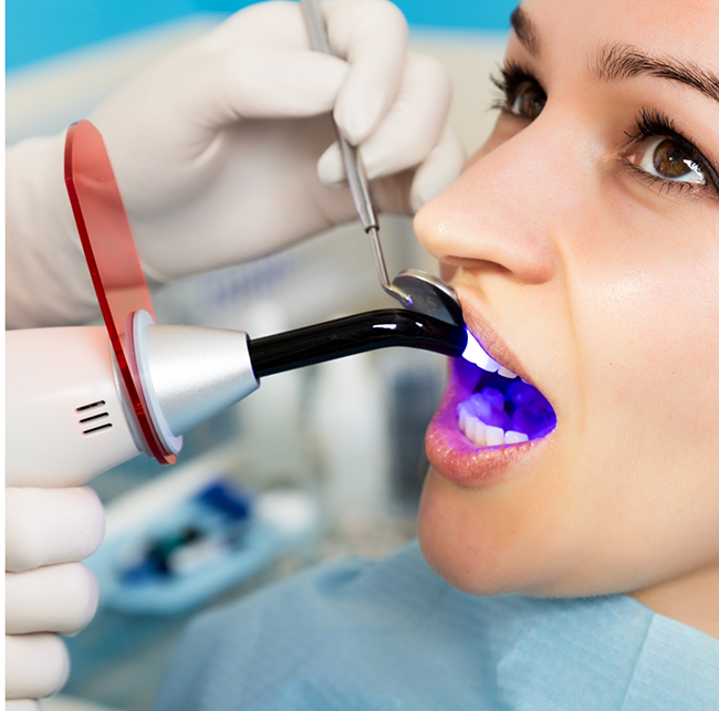 Woman getting dental bonding in Sparks on a front tooth