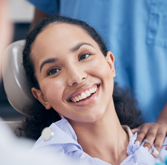 Woman smiling during a preventive dentistry checkup