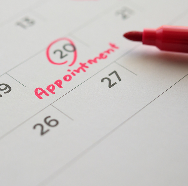 Date of a dental appointment circled on a calendar